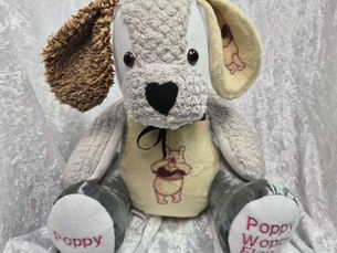 Soft keepsake dog made from a pet’s blankets with embroidered details, created to bring comfort after pet loss.