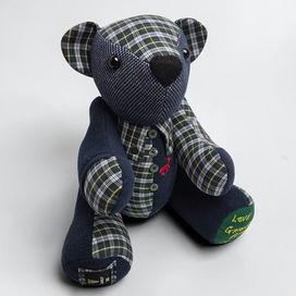 Handmade blue shirt jointed memory bear UK, patchworked from navy check and houndstooth shirts, featuring the original embroidered stag logo and 'Love Grandad' on the paw.