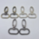 swivel lobster clasps in assorted finishes — brushed brass, silver, and gunmetal — arranged in two neat rows on a white backg