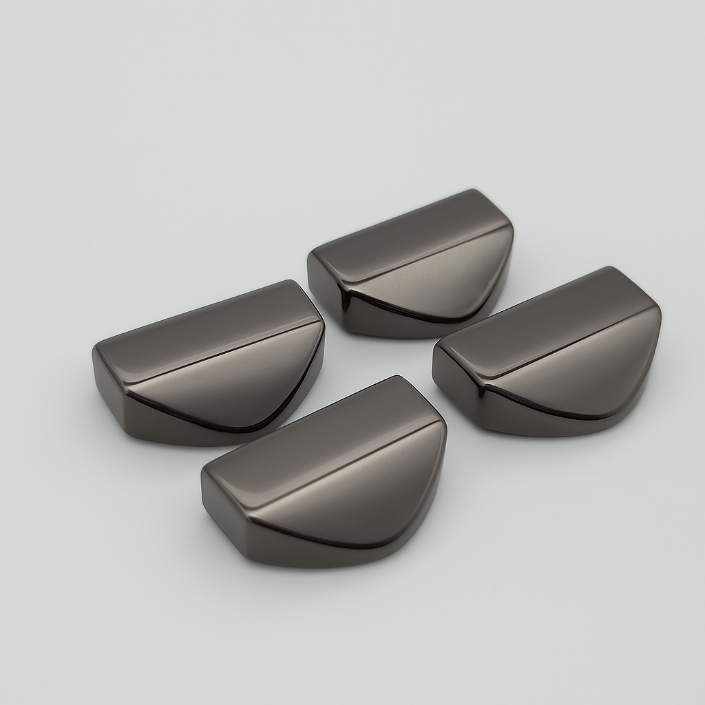 Set of four 18mm tapered strap ends in a smooth gunmetal finish, displayed on a plain background.