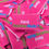 Thumbnail: A pile of bright pink woven labels with the bold text “Hand F***ing Made” in white, green, and blue thread.