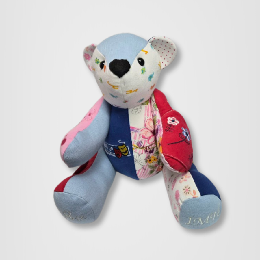 Button jointed memory bear made from baby clothes in various colours and tones
