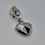 Thumbnail: Close-up of silver geometric heart metal zipper pull
