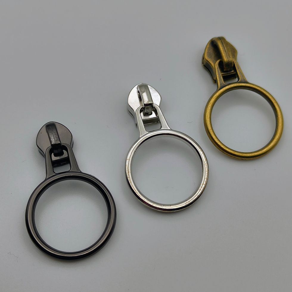 Set of three circle zipper pulls in silver, brass, and gunmetal – ideal for minimalist bag designs and handmade accessories.