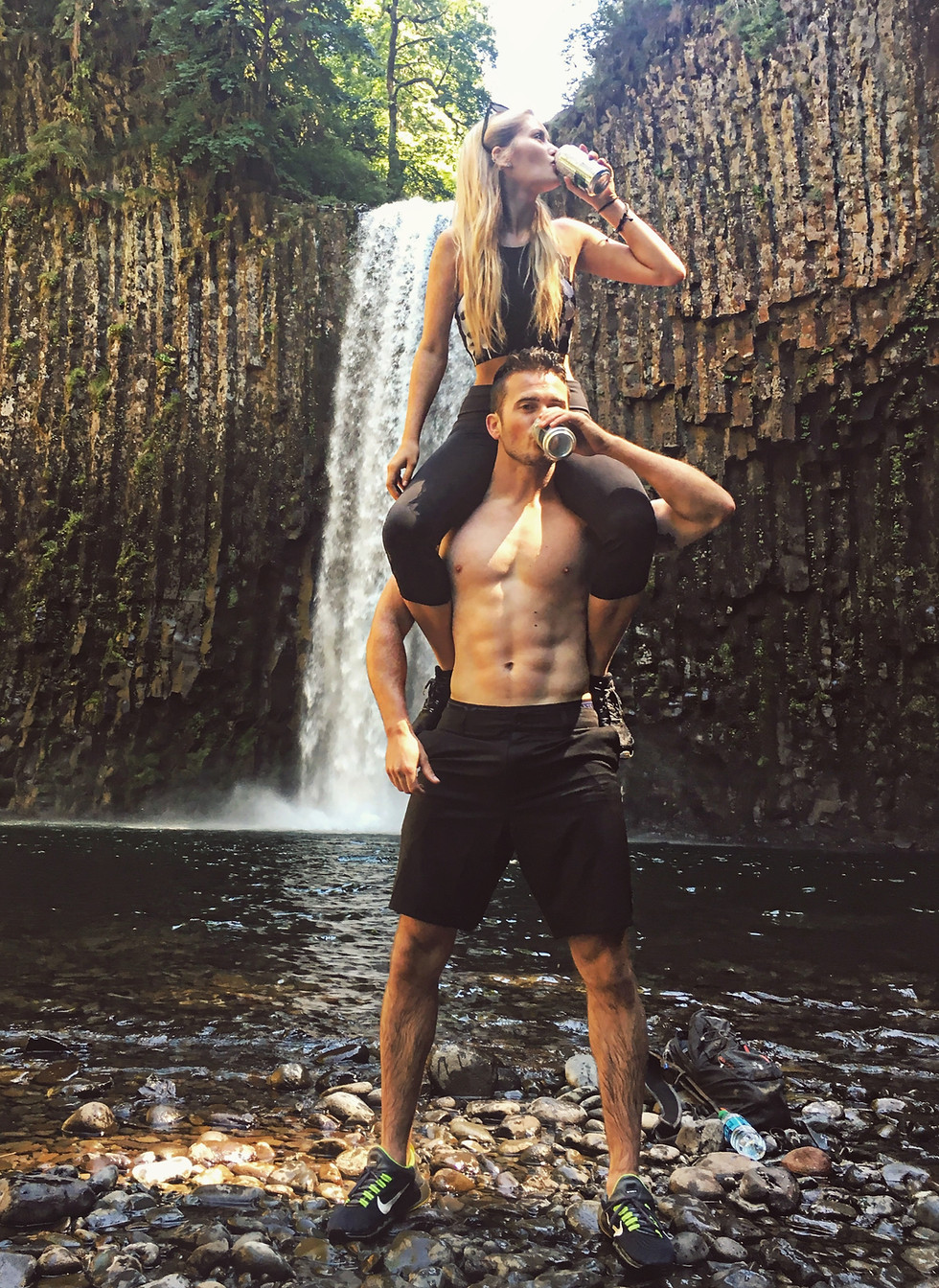 Kaylee and Jay in front of a waterfall