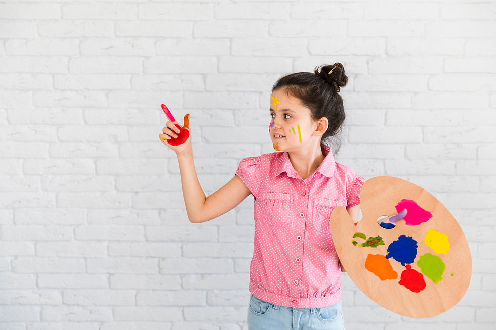 little-girl-holding-palette-showing-something-with-painted-red-finger