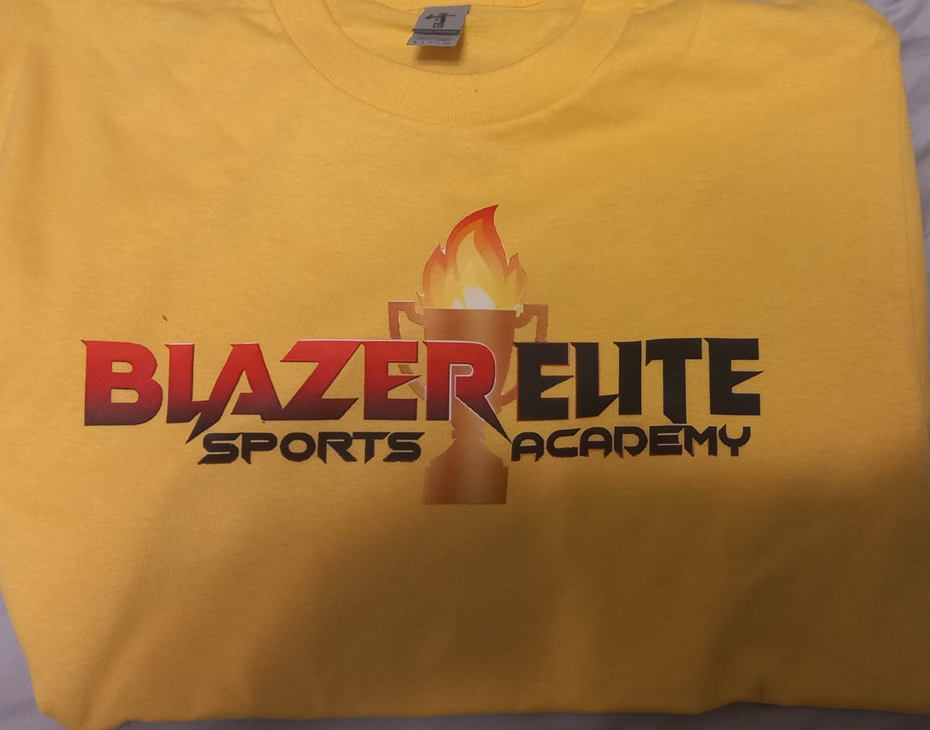 T-Shirts in Four Colors. Red, Yellow, Burgundy & White. Sizes Small-Extra Large
