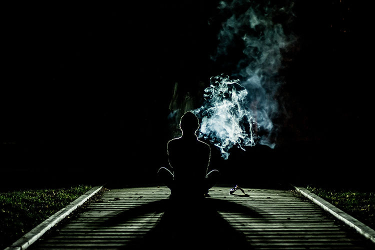Person at Night with Smoke