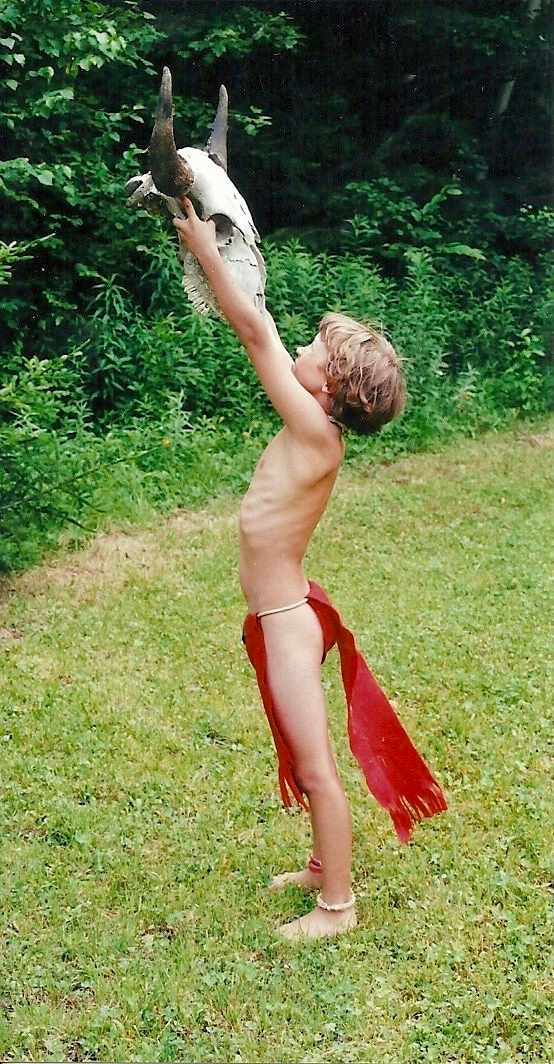 Boy in breechclout holding a buffalo skull in Vermont