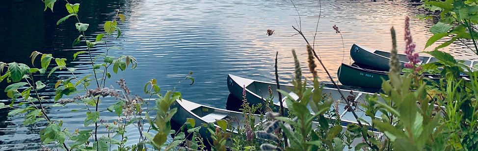 Canoes beached at the lake