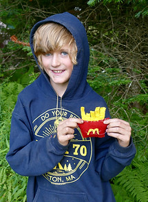 Boy holding a balsam pillow