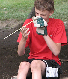 Boy making an arrow