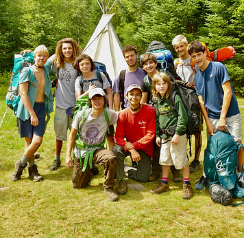 A group of boys preparing to leave on a three day hike