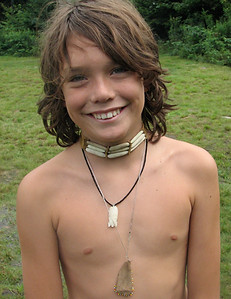 A boy wearing his hobblebush choker