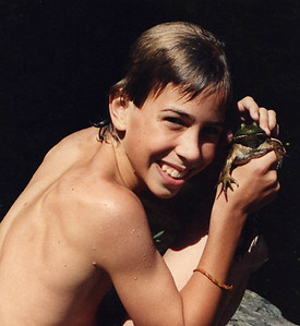 A boy with a bull frog