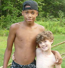Two smiling campers pose for the camera