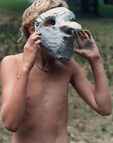 Boy and his paper mache mask