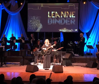 Leanne Binder on stage at live event