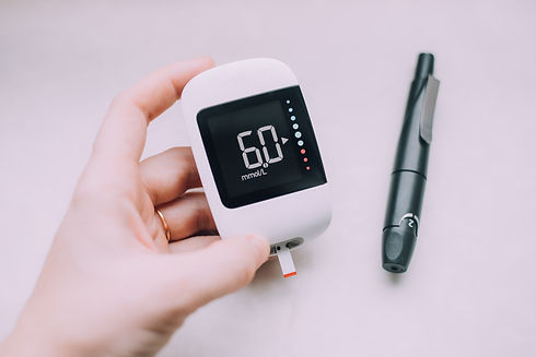 hand-holds-digital-blood-glucose-meter-device-2026-03-09-22-30-27-utc.jpg