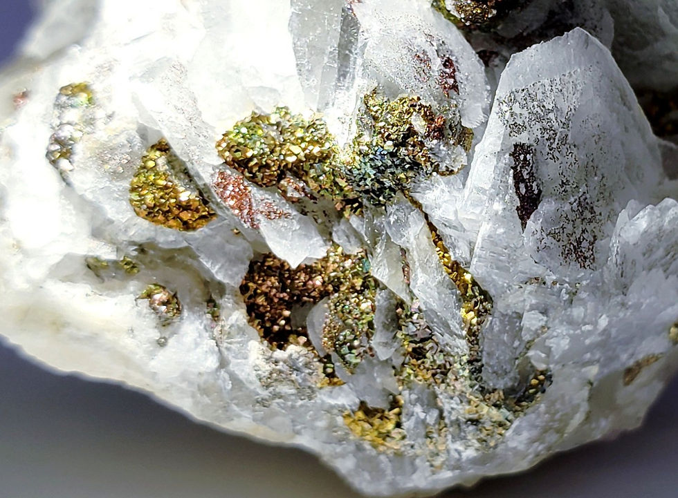 Thumbnail: Iridescent Chalcopyrite on Calcite from Manaoshan Mine