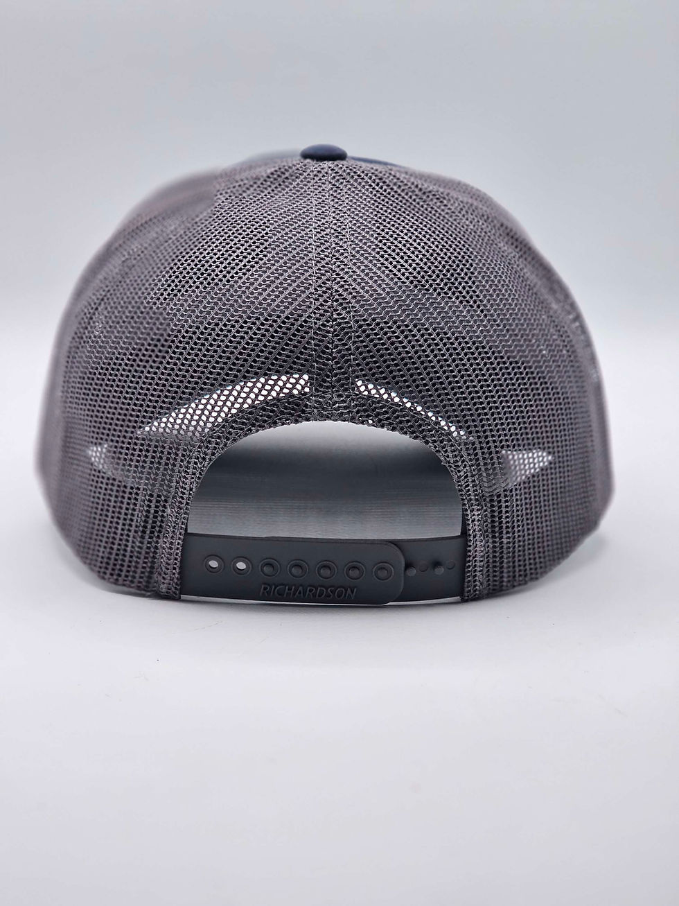 Thumbnail: Heather, Navy, Metallic Silver Bourbon Original Trucker Hat with Bourbon Candle Company brand logo (back view)