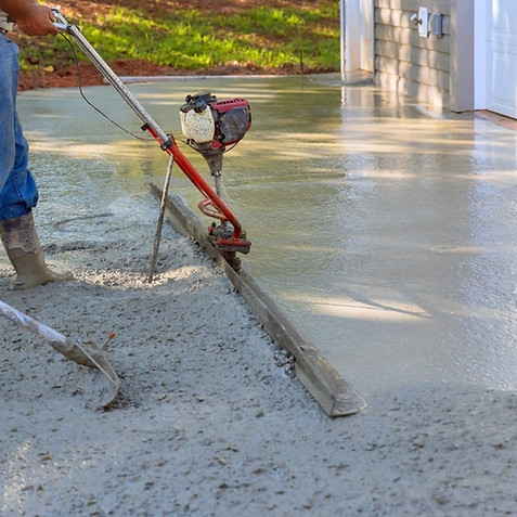 contractor using a power trowel
