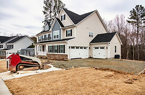 bobcat in driveway for concrete removal-min.jpeg
