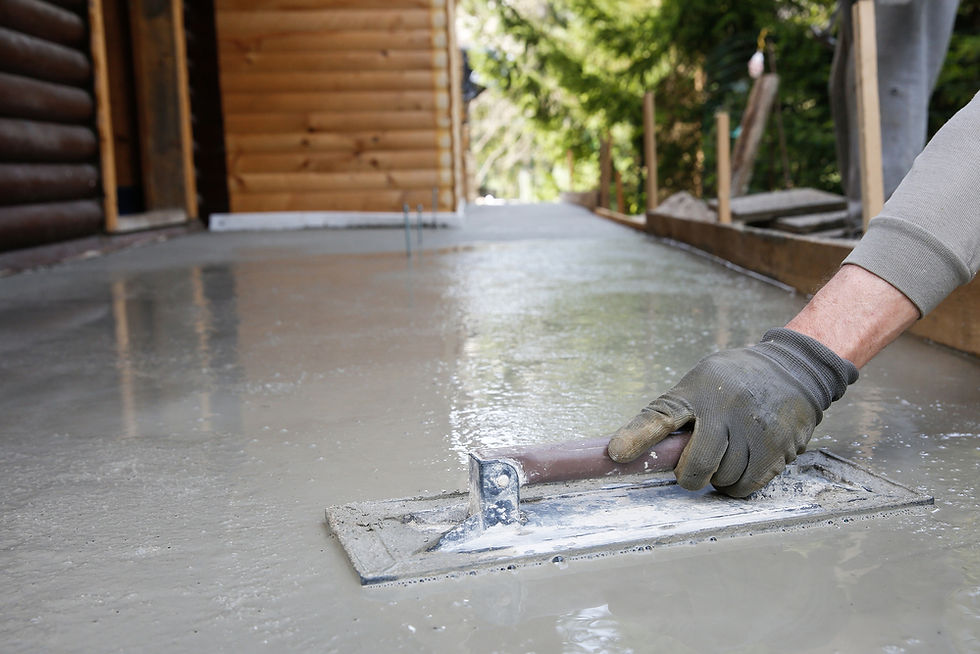 concstruction worker trowelling cement
