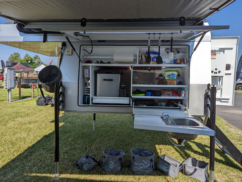 Gullwing, flatbed, pop top, Overland camper with shower, ladder, electrical system, water tank and kitchen