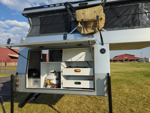 Gullwing, flatbed, pop top, Overland camper with shower, ladder, electrical system, water tank and kitchen