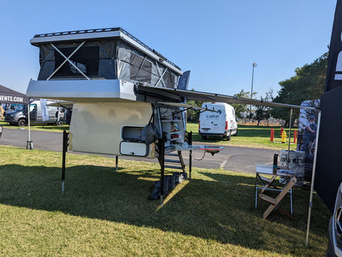 Gullwing, flatbed, pop top, Overland camper with shower, ladder, electrical system, water tank and kitchen