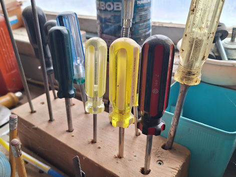 A collection of screwdrivers in a workshop