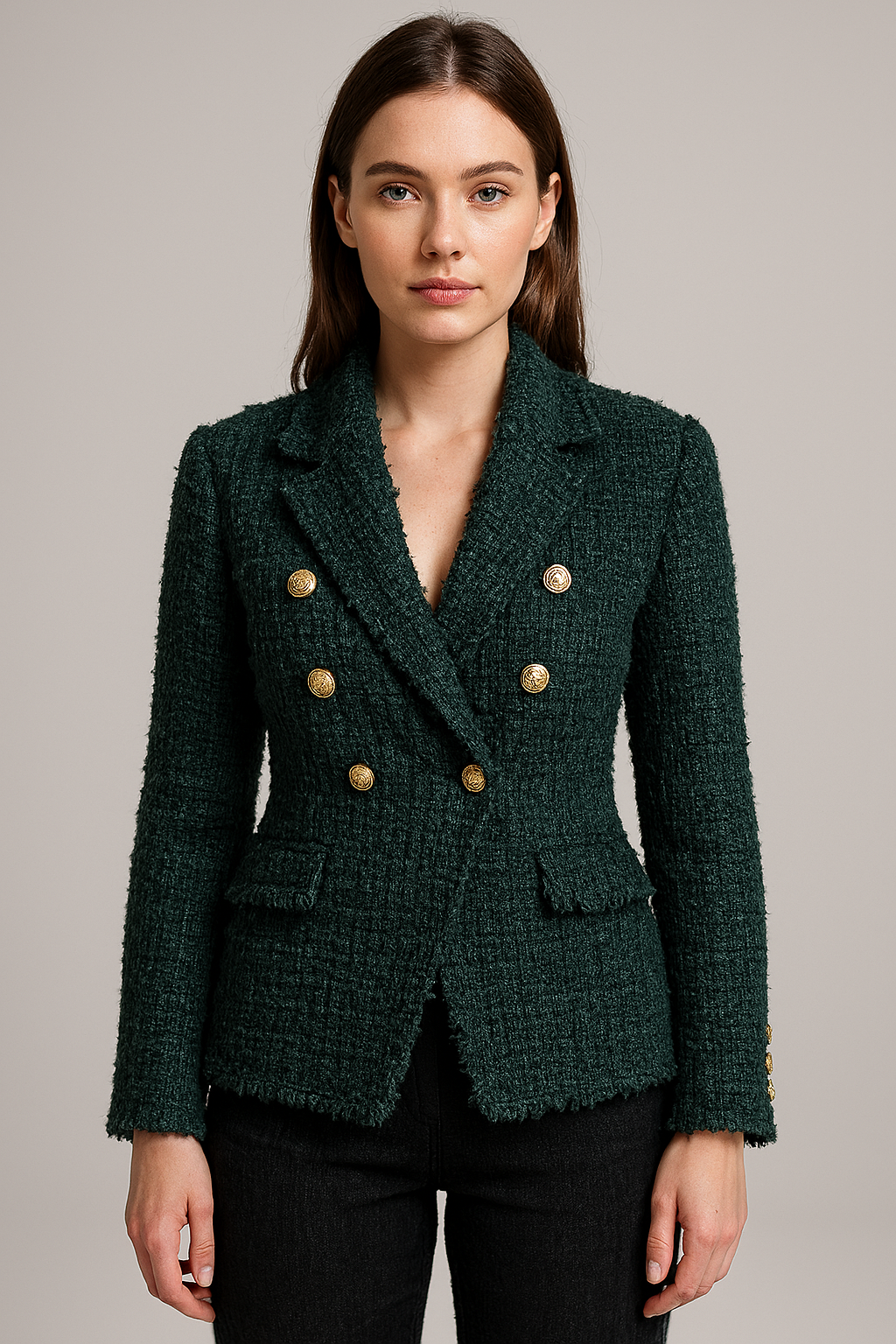 Woman in green tweed blazer with gold buttons