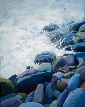water breaking on a shore of pebbles