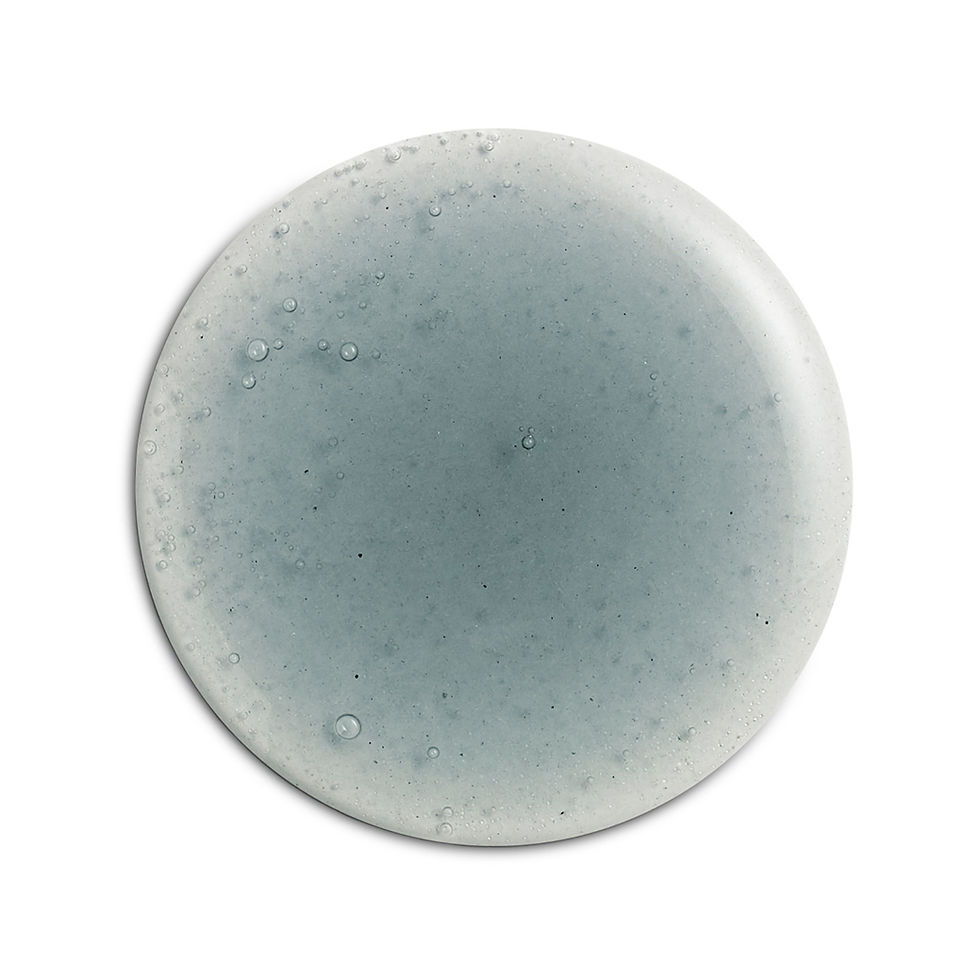 Circular droplet of skincare product against a white background.