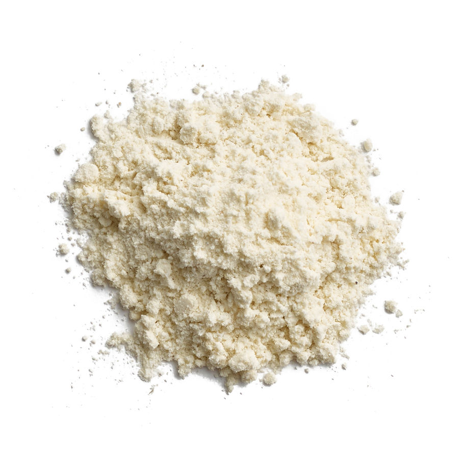Pile of light beige powder, likely flour, against a clean white background.