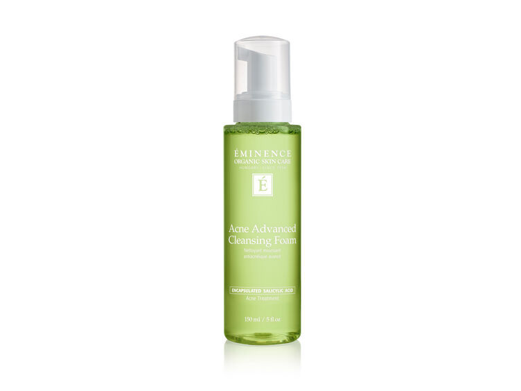 Green bottle of Emergence product, Anti-Advanced Cleansing Foam, skincare product.