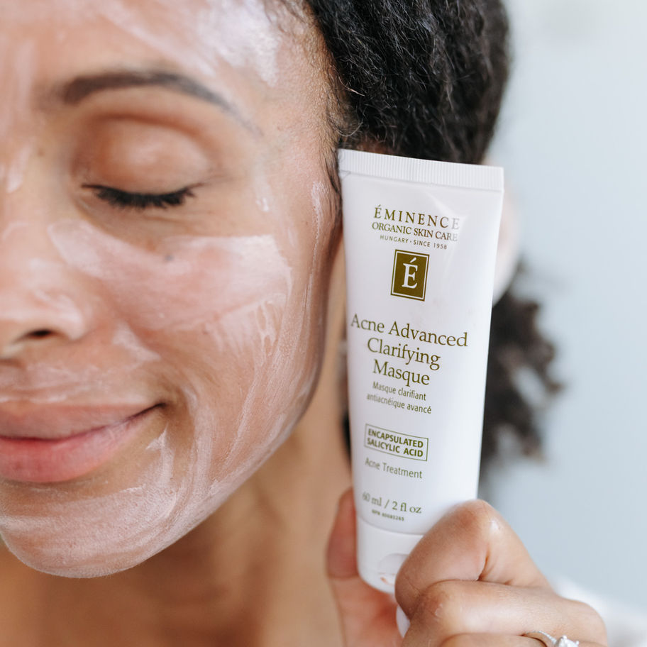 Woman holding tube with text, Extra Advanced Clarifying Masque, Update - Skin by Tae