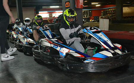 Close-up of a driver navigating a sharp turn in a kart