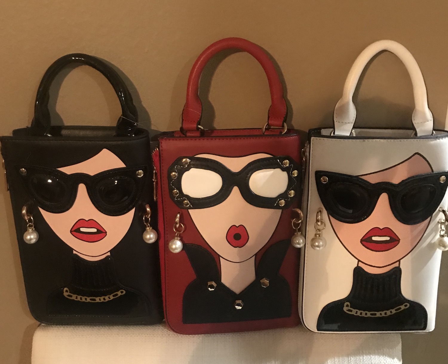 Thumbnail: PEBBS Wristlet Face Purse