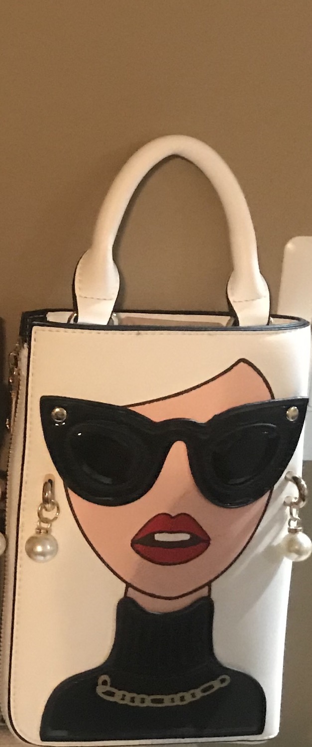 Thumbnail: PEBBS Wristlet Face Purse