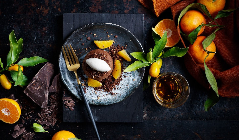 Chocolate cake a la mode with fresh oranges