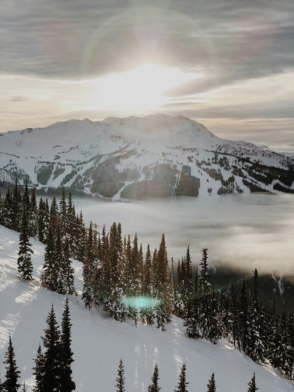 Sun setting over Whistler Mountain from Blackcomb