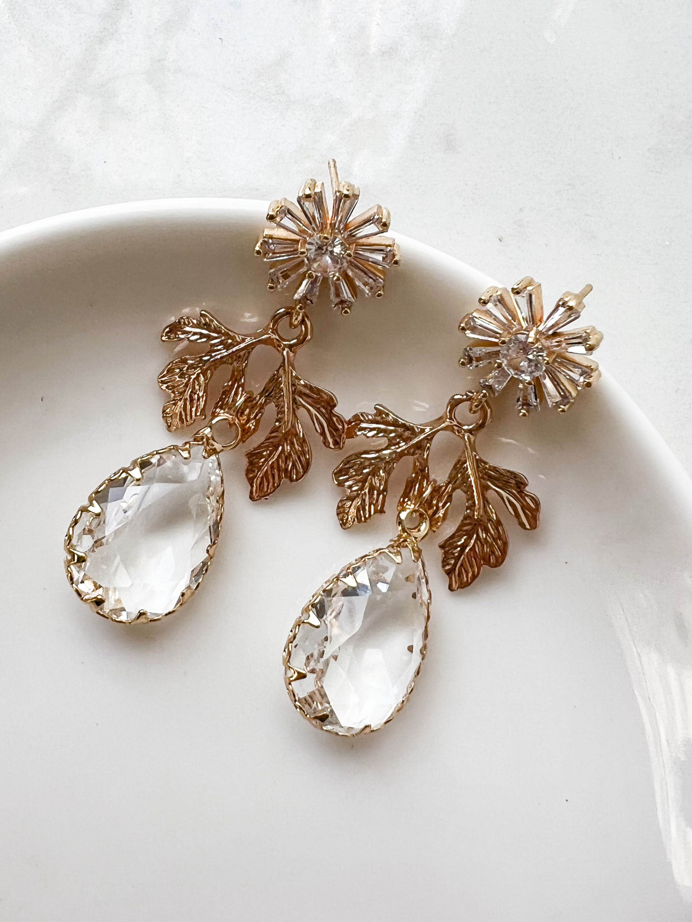floral crystal earrings on dish