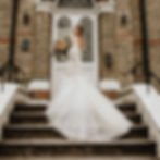 Thumbnail: bride on steps holding a bouquet
