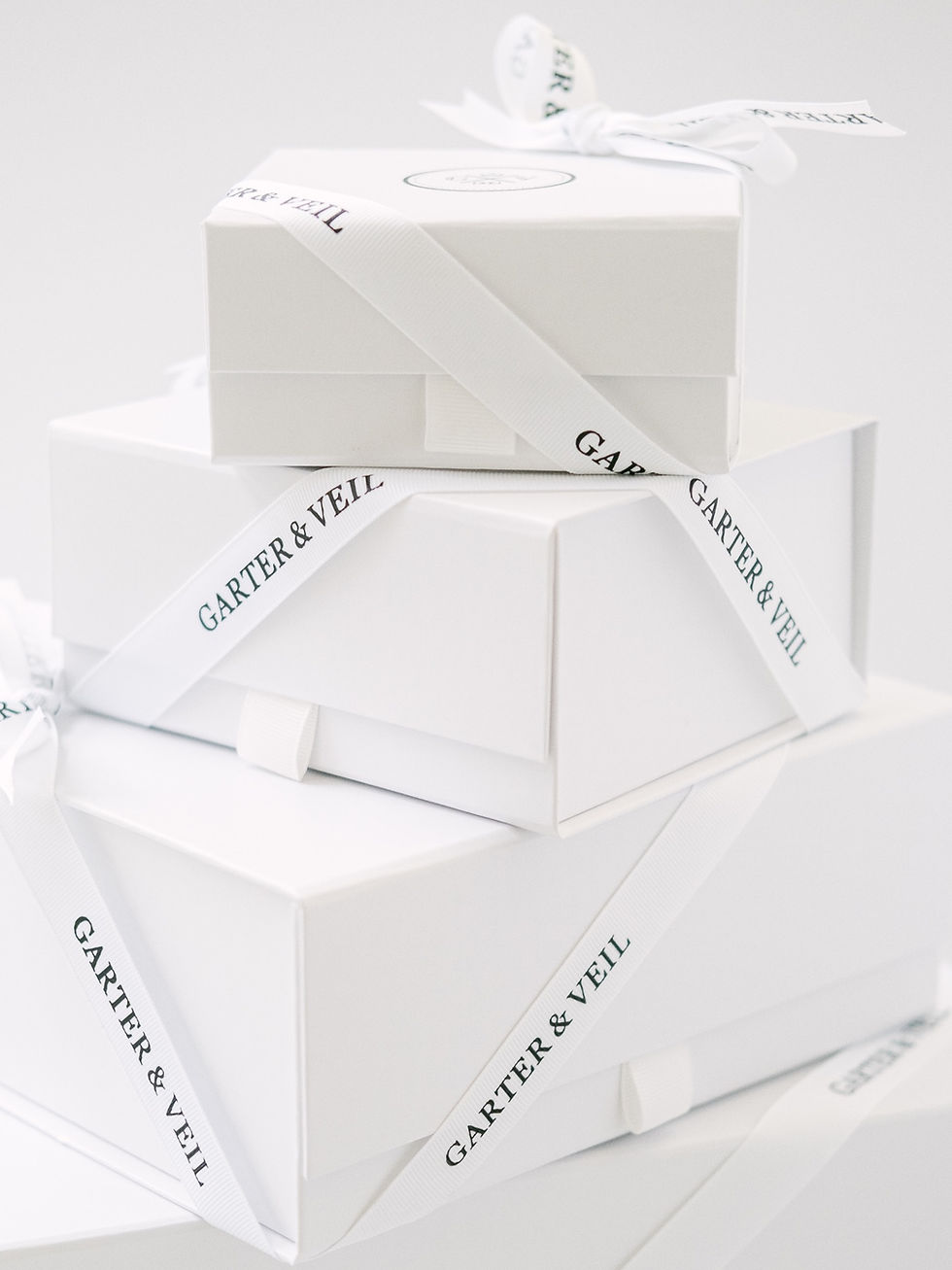 Thumbnail: stack of white gift boxes