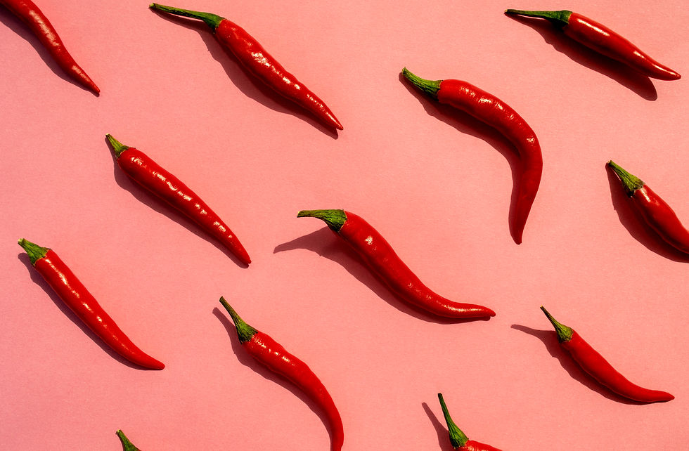 Red chilli peppers pattern on pink background. Top view. Hot pepper flat lay. Chili wallpa