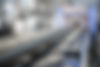 Equipment of a plant producing plastic pipes. Conveyor in the industrial factory for the p
