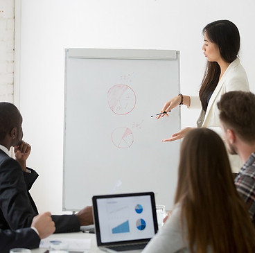 businesswoman-giving-presentation-marketing-research-results-business-training.jpg