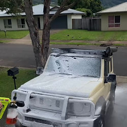 Suzuki Jimny coated in thick snow foam during a luxury pre-wash treatment by Samurai Auto Detailing — professional paint-safe wash process in Cairns.